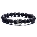Matte black agate and volcanic stone beaded bracelet with silver crown charm on white background - Matte Black Lava Crown