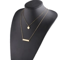 Double layered gold necklace with minimalist bar and circle pendants on a black mannequin - Gold (MP587)