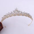 Detailed macro view of leaf-shaped bridal crown with crystals and golden plating - KC Gold White Rhinestone