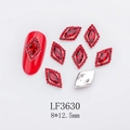 Macro view of 8x12.5mm red rhombus nail crystal with silver base and rhinestone border - Silver Base Marquise Red Stone (LF3630)