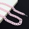 Detailed close-up of pink acrylic eyewear chain with secure silicone loop attachments - Hot Pink