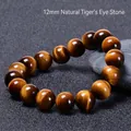 Macro shot of 12mm natural tiger eye stone bracelet beads with glossy cat-eye effect - Yellow Brown Tiger Eye / 12mm