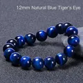 Macro shot of 12mm Natural Blue Tiger Eye stone beads showing silky cat eye effect - 12mm / Natural Blue Tiger Eye