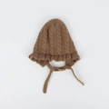 Detail of coffee brown knit baby hat featuring cable stitch patterns and ruffled edges - Kids (46-50CM) / Coffee