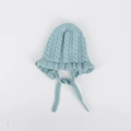 Detail view of baby knit bonnet featuring cable stitch pattern and ruffled edges in light blue - Kids (46-50CM) / Light Blue