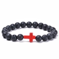 Lava stone bead bracelet with a red cross charm on a white background - Red Howlite