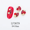Detailed macro view of 8x10mm red marquise rhinestones with metal borders for nail art - Gold Base Red with AB (LF3679)