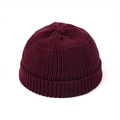 Close-up of burgundy knit beanie showing vertical ribbing texture and rolled edge - Burgundy