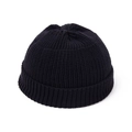 Close-up of the ribbed knit texture and folded cuff of this solid black beanie cap - Black