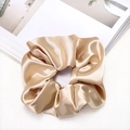Detail view of champagne gold satin scrunchie with silky texture and elegant shine - Dark Champagne