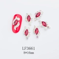 Macro shot of 8x16mm red marquise nail rhinestone with silver setting and SKU LF3661 - Bright Red (LF3661)