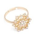 Close-up of golden snowflake ring with cubic zirconia and adjustable open band detail - Rhinestone Snowflake