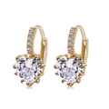 Golden heart earrings with AAA zircon stones and pavé set hoop on white background - Heart Hoop Earrings / Gold Color - White Zirconia