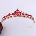 Detailed close-up of a gold crystal bridal crown featuring vibrant red marquise rhinestones - Gold with Red Rhinestones