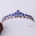 Detail view of gold wedding crown featuring blue marquise crystals and white rhinestones - Gold with Blue Rhinestones