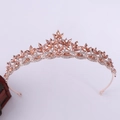 Close-up of rose gold bridal crown with champagne crystals and leaf vine details - Rose Gold Peach Rhinestone