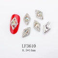 Detail of diamond-shaped nail charms with colorful AB rhinestones on a red nail - Silver Base Hollow Aurora Drop (LF3610)