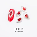 Macro shot of rhombus nail art crystal charms with red teardrop rhinestones - Silver Base Hollow Red Diamond (LF3618)