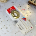 Golden number 0 birthday candle with matte metallic finish in clear blister packaging - Gold