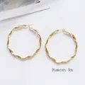 Minimalist twisted gold hoop earrings for women, 5cm diameter with spiral metal design - 5cm / Gold