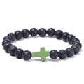Black lava rock beaded bracelet featuring a green turquoise cross stone charm - Light Turquoise