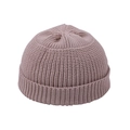 Detail of pink ribbed knit beanie showing thick texture and folded cuff for winter warmth - Beige