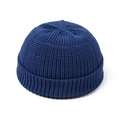 Detail of dark blue ribbed knit Miki hat featuring a retro rolled edge and textured fabric - Royal Blue
