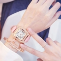 Detail of pink crocodile leather strap and rose gold crystal square watch on wrist - Pink Watch + Bracelet