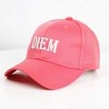 Detailed close-up of a pink cotton baseball cap with white DIEM embroidery and curved brim - Adjustable / Watermelon red