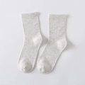 Light grey cotton crew socks featuring a ribbed cuff and minimalist knitted texture - Gray