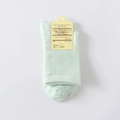 Three-pack of mint green cotton crew socks with ribbed texture and original paper tag - One Size / Green
