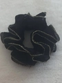 Elegant black fabric scrunchie with metallic gold trim edge on a soft white background - Black