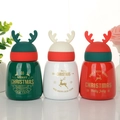 Christmas thermos bottle with cute reindeer antlers in green, white, and red festive colors - 300ml / Multicolor