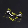 Macro view of 8mm curved stainless steel eyebrow piercing with 3mm metal balls on black background - Curved Barbell/Ball/3mm