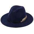 Close-up of navy blue wool fedora hat featuring a black leather band and gold metal leaf - Navy Blue