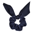 Detail of navy blue satin scrunchie featuring elegant rabbit ear ribbon and soft silk texture - Navy Blue