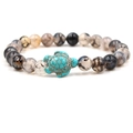 Agate beaded bracelet featuring a vintage turquoise turtle charm on white background - Green Turtle Dragon Vein Stone
