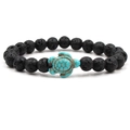 Detail of lava rock beaded bracelet with a turquoise turtle charm on a white background - Green Turtle Lava Stone