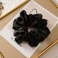 Elegant large black satin scrunchie with a glossy silk-like finish and soft pleats - Black