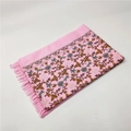 Close-up of pink cashmere-like scarf featuring intricate floral embroidery and tassel fringe - Bright Pink 450g