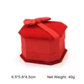 Red hexagonal velvet ring box featuring a soft texture and elegant top bow decoration - Ring Box / Red With Red Interior