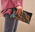 Ethnic embroidered canvas clutch featuring floral patterns and a blue silk tassel charm - Galsang Flower