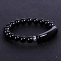 Macro shot of black beaded bracelet featuring a sleek curved bar and silver metal spacer - Black Agate (SL245A4903)
