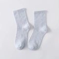 Light blue cotton blend mid-calf socks with ribbed cuffs on a neutral grey background - Blue
