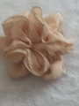 Minimalist cream beige fabric hair scrunchie with subtle golden edges on soft background - Beige