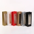 Front view of paper wine gift bags with clear windows and woven handles in six colors - Mixed Colors With Window
