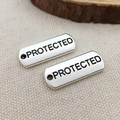 Rectangular antique silver alloy charms with PROTECTED engraving for DIY jewelry making - Protected