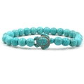 Detailed close-up of a turquoise beaded bracelet featuring a carved sea turtle charm - Green Turtle Blue Turquoise