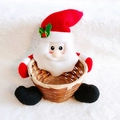 Detail of Santa Claus bamboo basket with red plush fabric on white fleece background - Classic Santa Claus