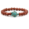 Brown goldstone beaded bracelet featuring a small blue turquoise turtle charm - Green Turtle Goldstone